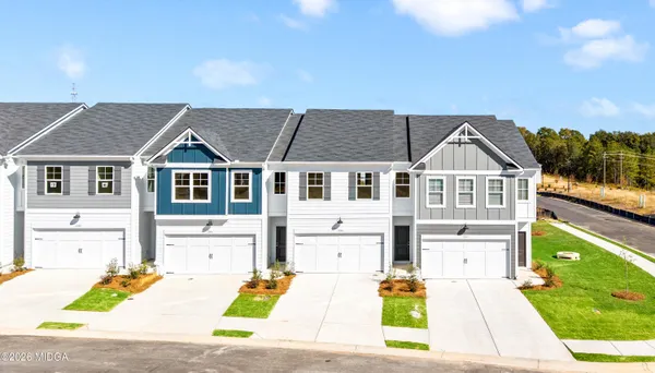 a view of multiple houses with yard