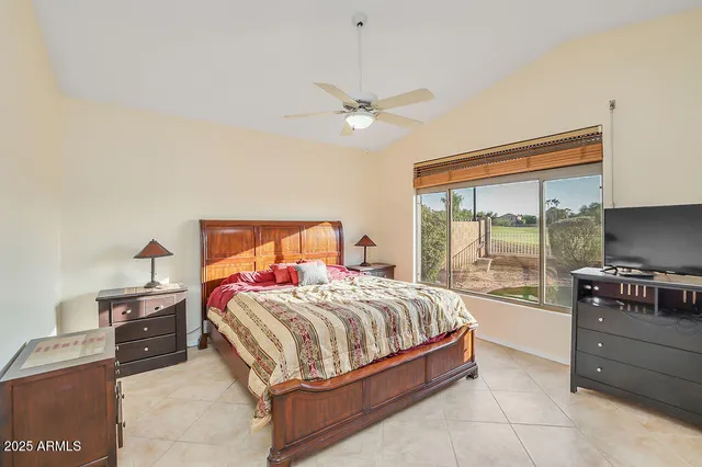 a bedroom with a bed and a table