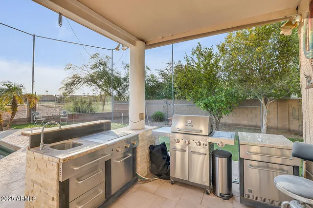 a view of a house with a yard and a garage