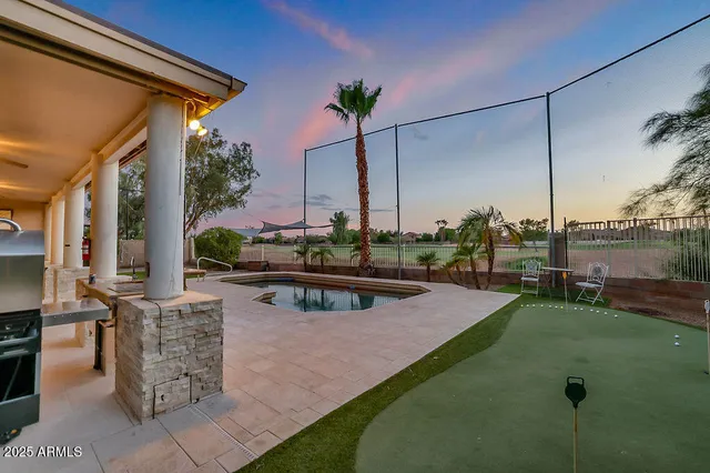 a view of a swimming pool with a lounge chairs
