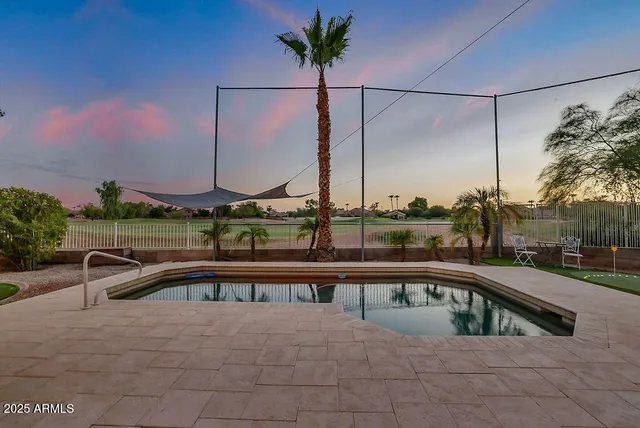 a view of a backyard with sitting area