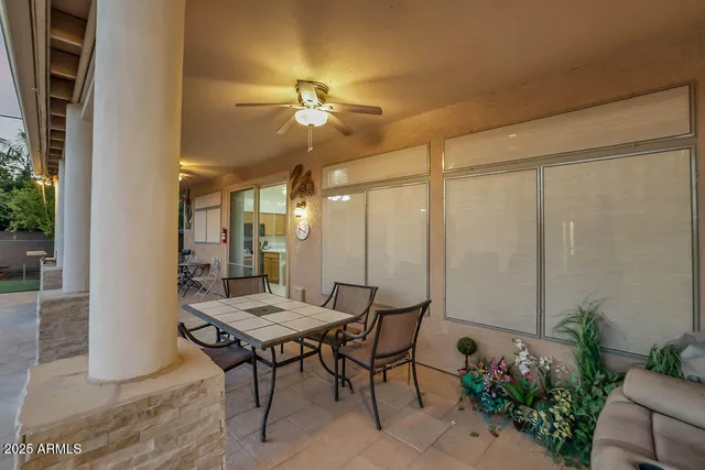a front view of a house with swimming pool and porch