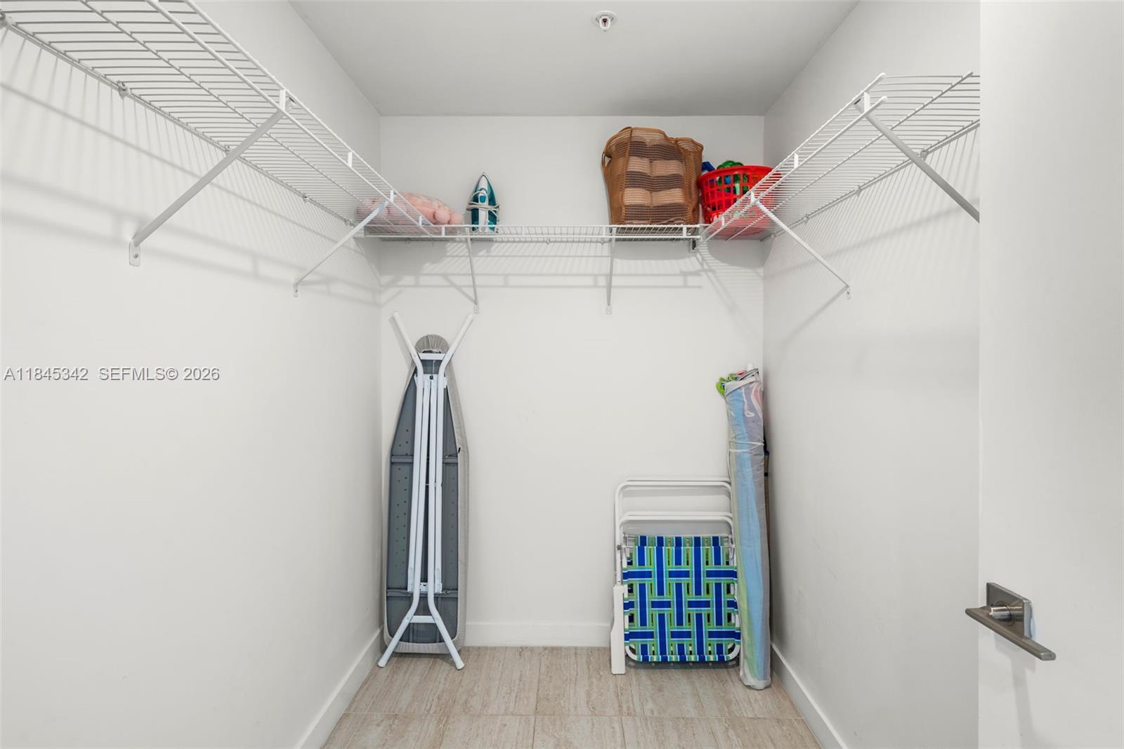 3900 Biscayne Boulevard, Unit S400 Miami, FL 33137 - Photo 16 of 50 a view of walk in closet with clothes and shoes