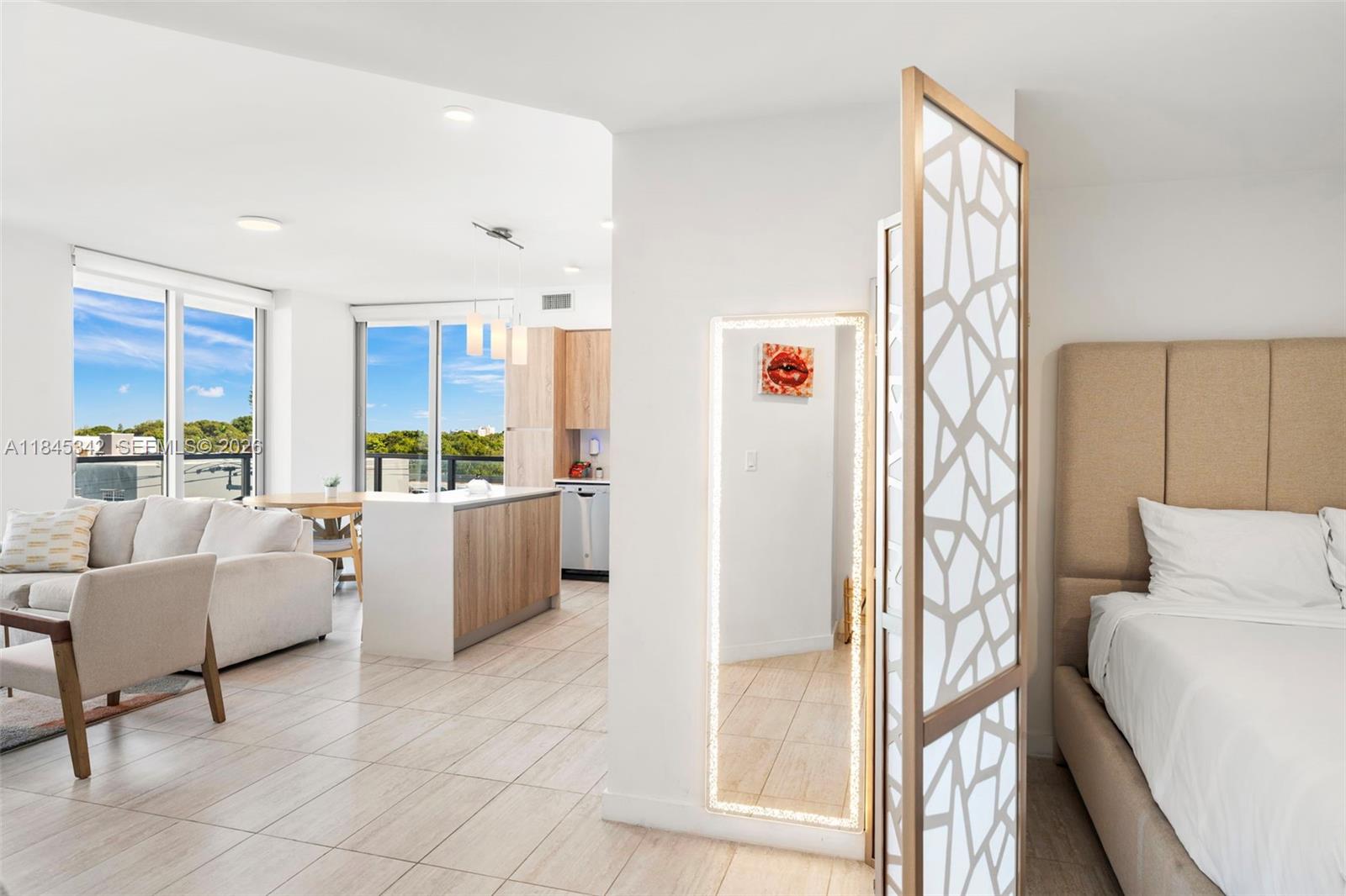 3900 Biscayne Boulevard, Unit S400 Miami, FL 33137 - Photo 19 of 50 a living room with furniture and a large window