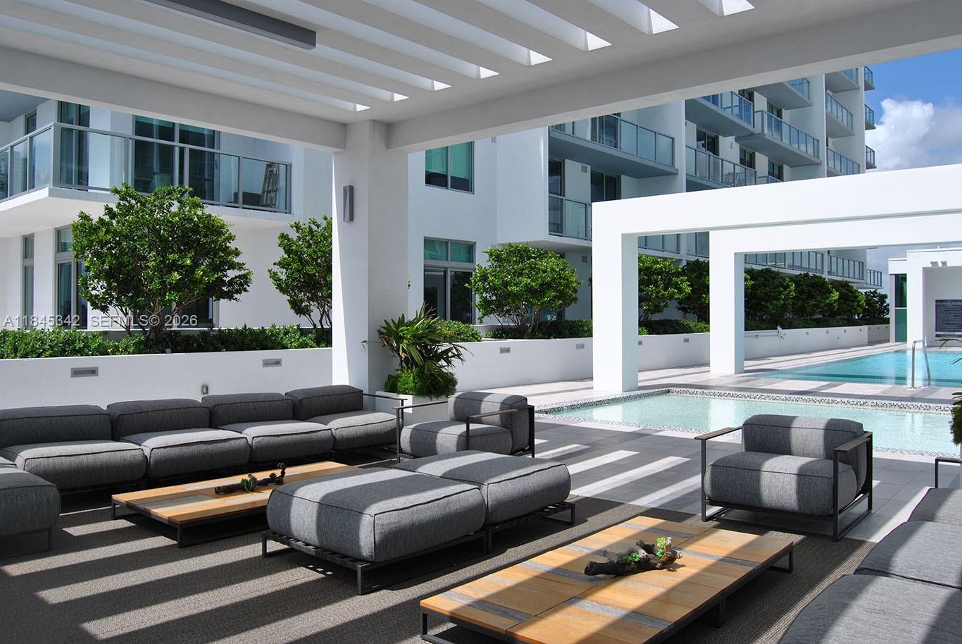 3900 Biscayne Boulevard, Unit S400 Miami, FL 33137 - Photo 32 of 50 a outdoor living space with furniture and a potted plant