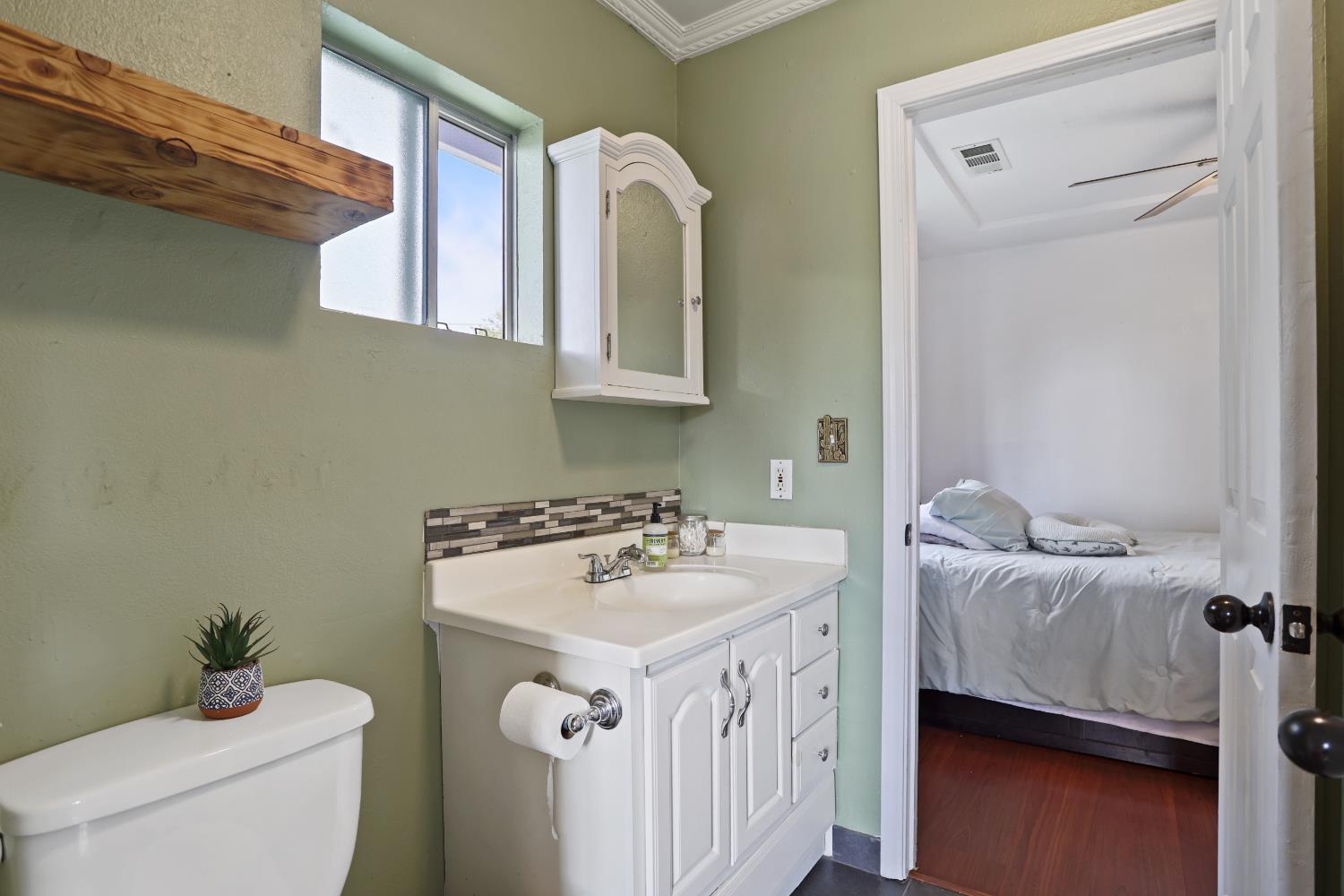 513 Harold Street Lodi, CA 95240 - Photo 12 of 29 a bathroom with a sink and a toilet