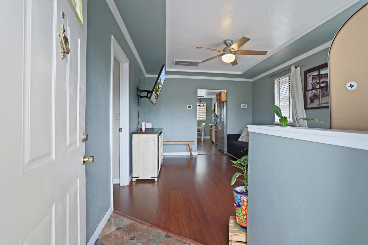 513 Harold Street Lodi, CA 95240 - Photo 6 of 29 a living room with furniture and a chandelier