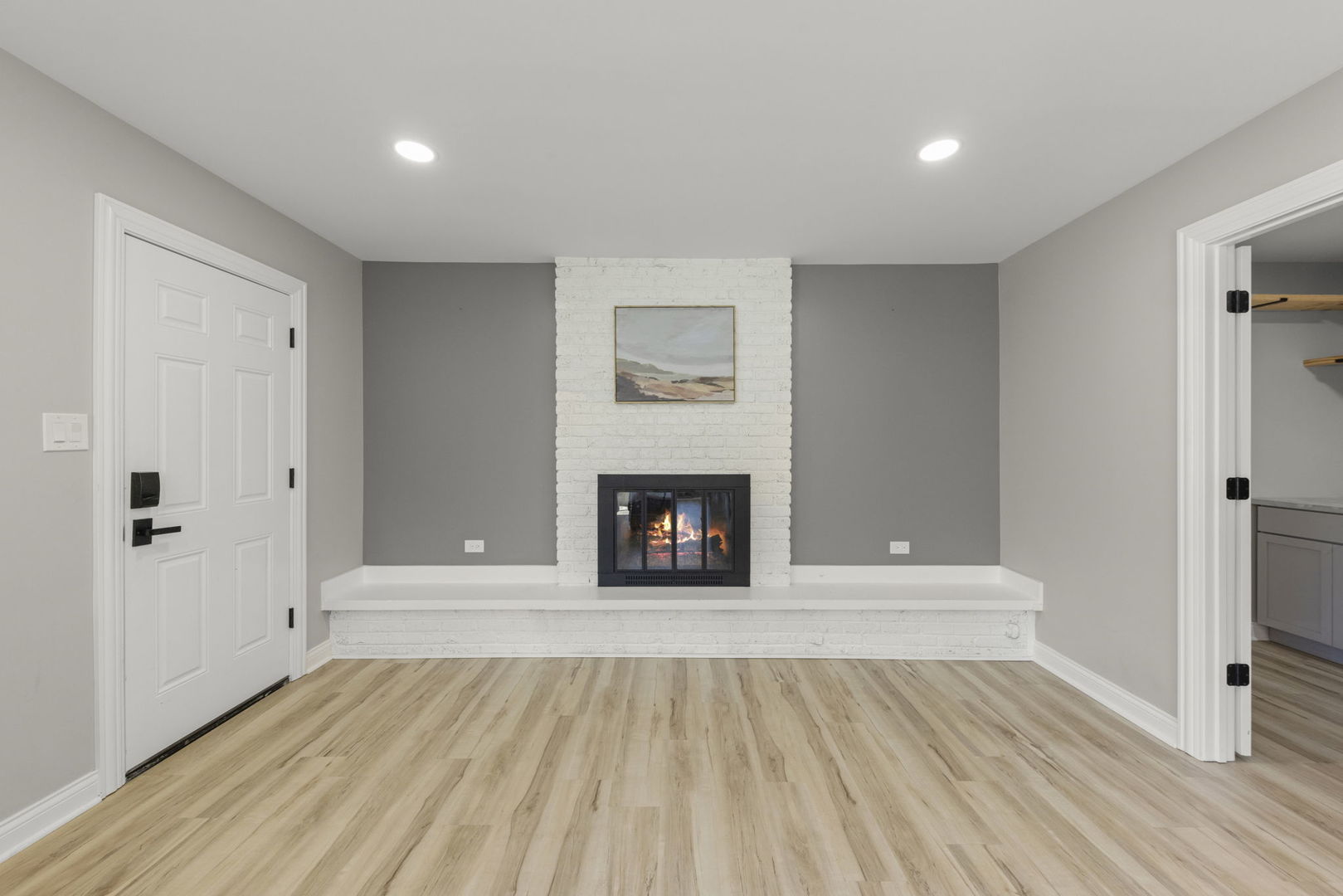 405 Turf Lane Wheaton, IL 60187 - Photo 12 of 29 a view of a livingroom with wooden floor and a fireplace