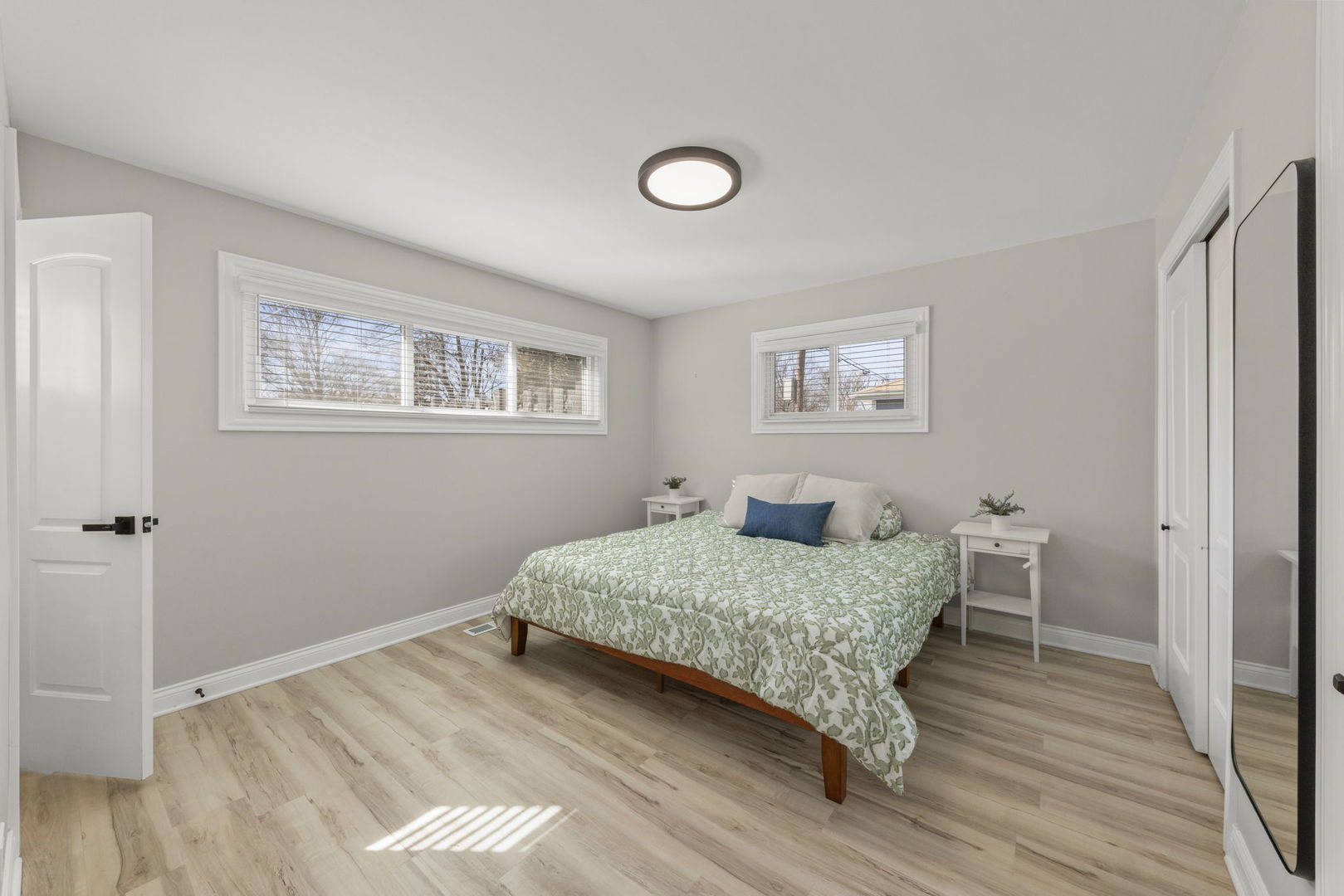 405 Turf Lane Wheaton, IL 60187 - Photo 15 of 29 a bedroom with a large bed and a chandelier