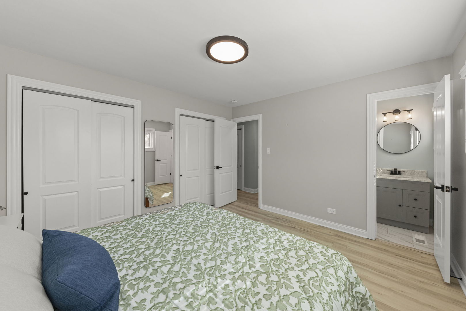 405 Turf Lane Wheaton, IL 60187 - Photo 16 of 29 a bedroom with a bed and a chandelier