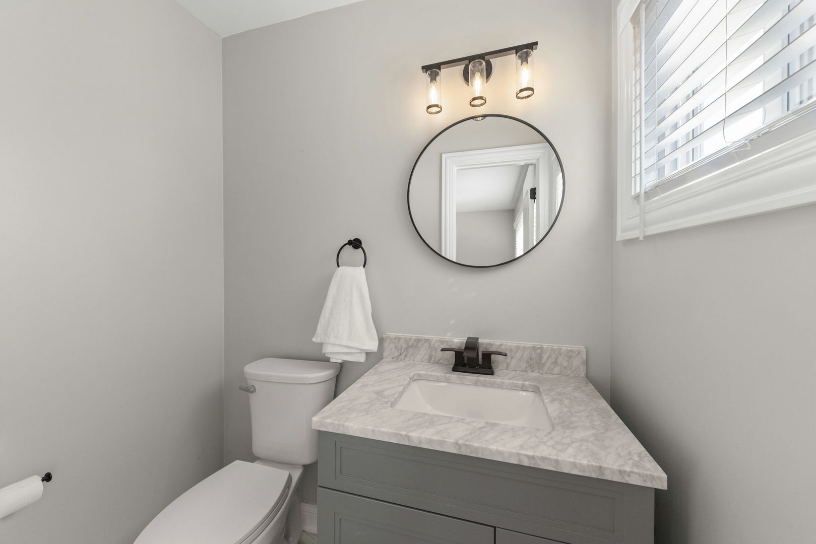405 Turf Lane Wheaton, IL 60187 - Photo 17 of 29 a bathroom with a sink and a mirror