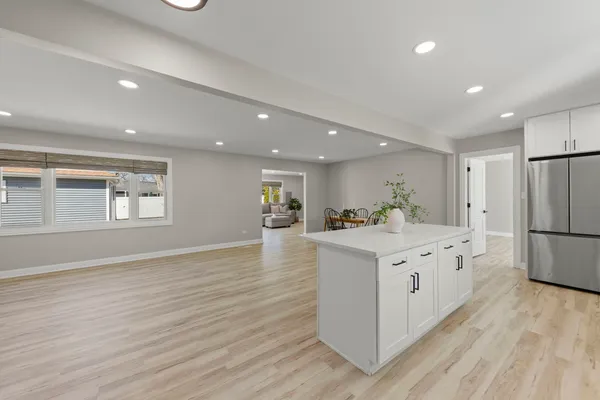 a kitchen with stainless steel appliances a white stove top oven and a refrigerator