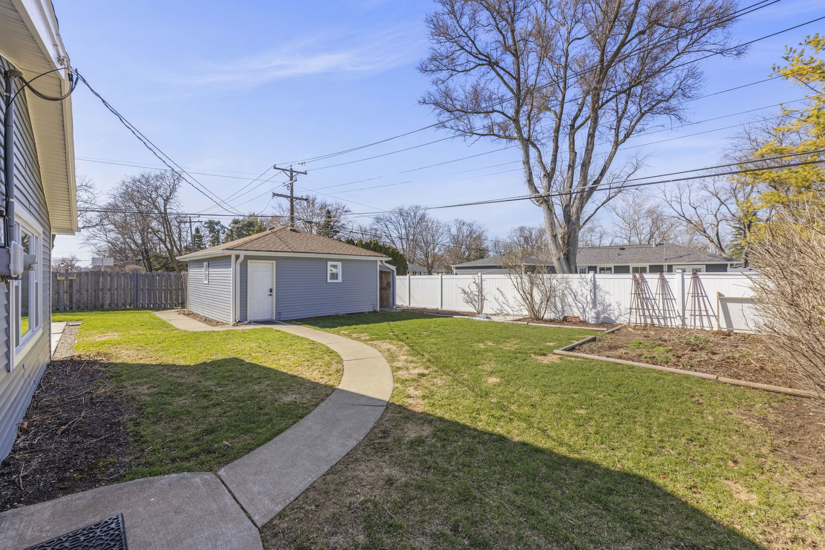 405 Turf Lane Wheaton, IL 60187 - Photo 24 of 29 a view of a swimming pool with a yard