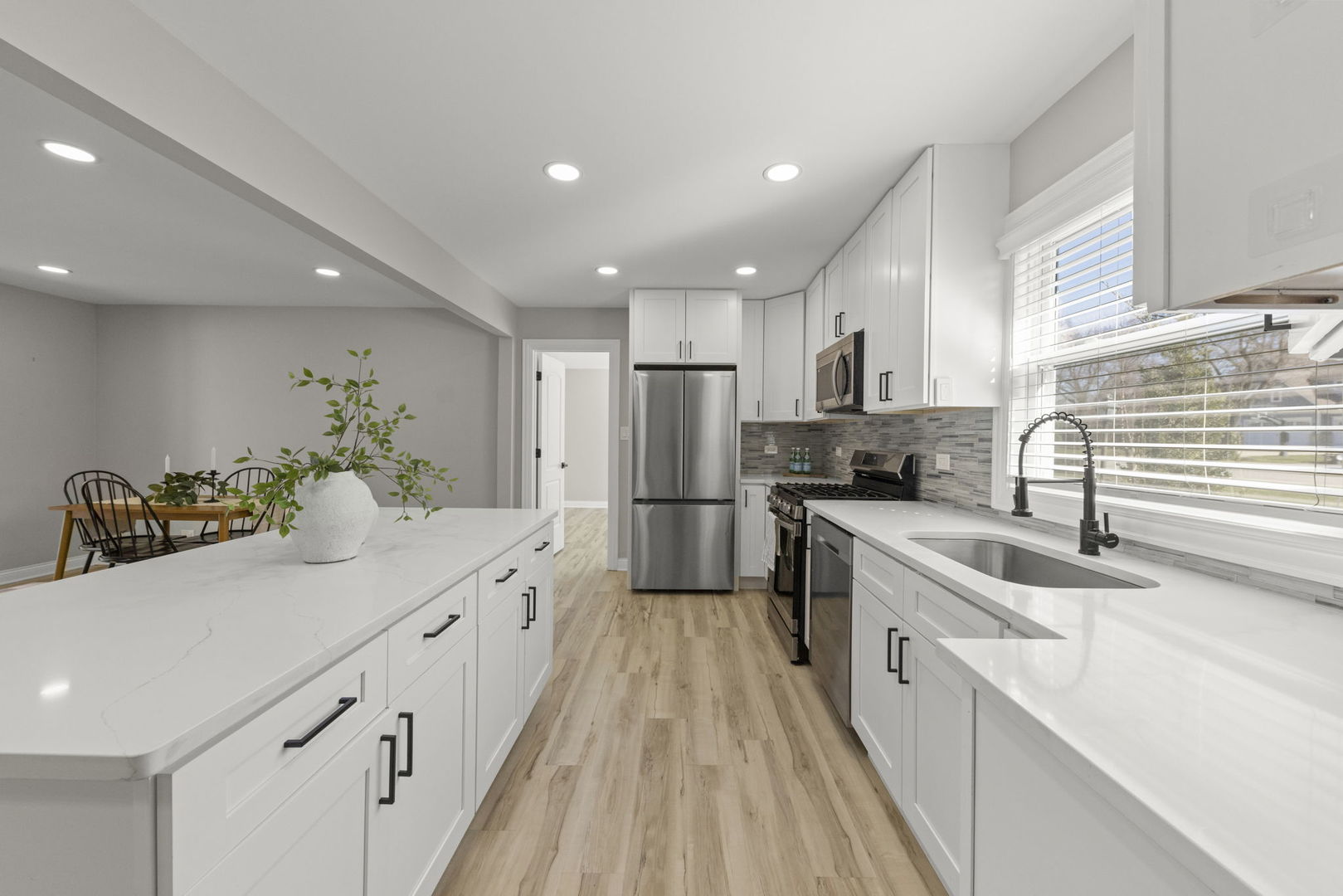 405 Turf Lane Wheaton, IL 60187 - Photo 4 of 29 a kitchen with stainless steel appliances kitchen island granite countertop a sink and cabinets