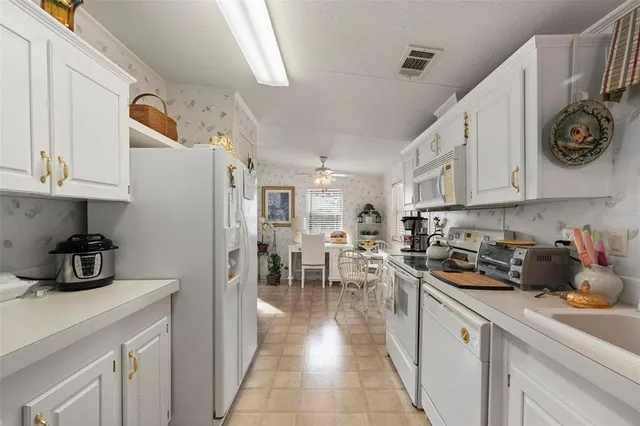 a view of a livingroom with furniture and a window
