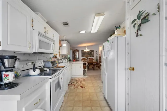 a view of a pathway of a house with a yard