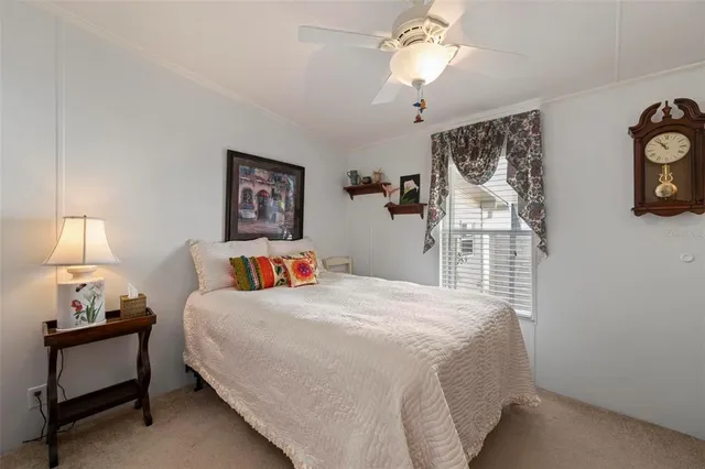 an aerial view of a house with a garden and lake view