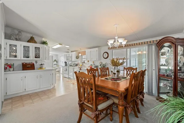 a kitchen with cabinets and window