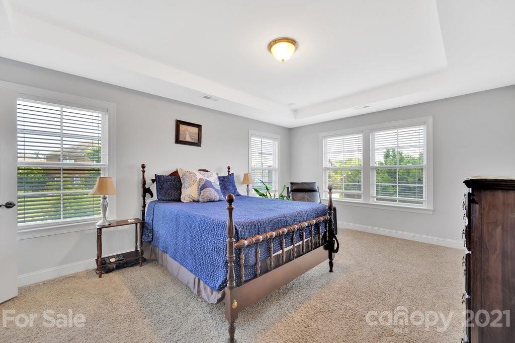 693 Old Cove Road Tega Cay, SC 29708 - Photo 29 of 38 a bed room with a bed and a window