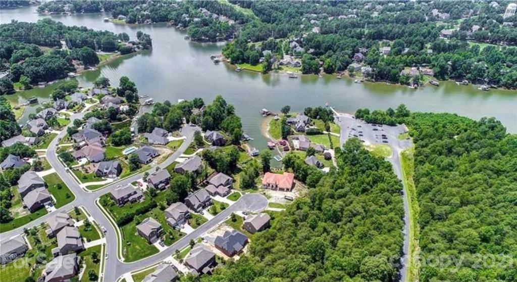 693 Old Cove Road Tega Cay, SC 29708 - Photo 37 of 38 an aerial view of lake residential house with outdoor space and trees around