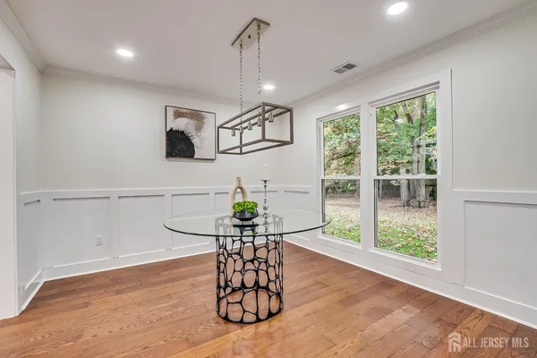 a living room with furniture a window and entryway