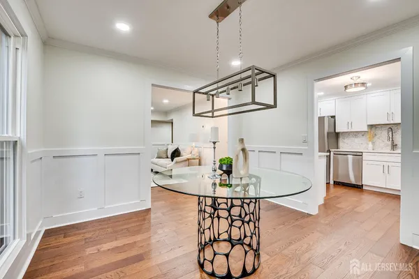 a kitchen with stainless steel appliances a refrigerator sink and cabinets