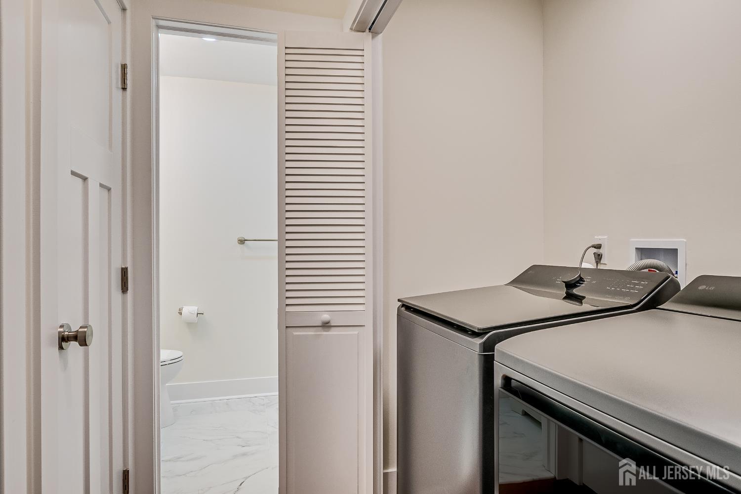 145 Maplewood Court Edison, NJ 08820 - Photo 24 of 37 a utility room with dryer and washer