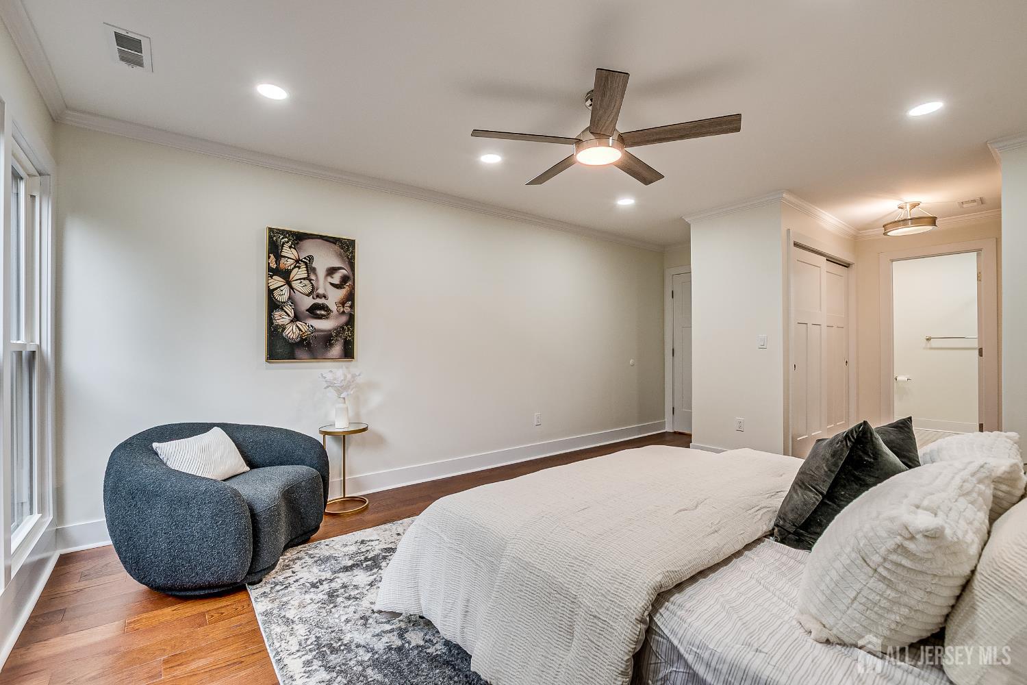 145 Maplewood Court Edison, NJ 08820 - Photo 28 of 37 a bedroom with a bed and ceiling fan
