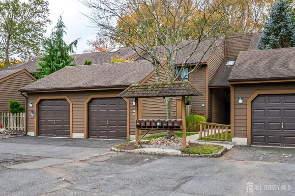a front view of a house with a garage