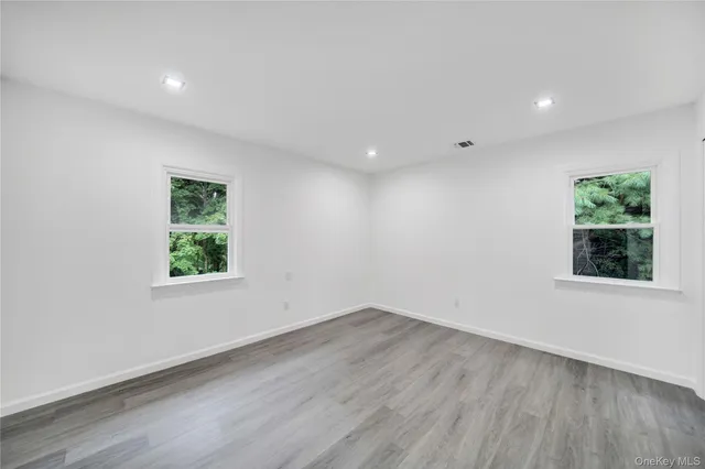 an open kitchen with kitchen island sink and refrigerator