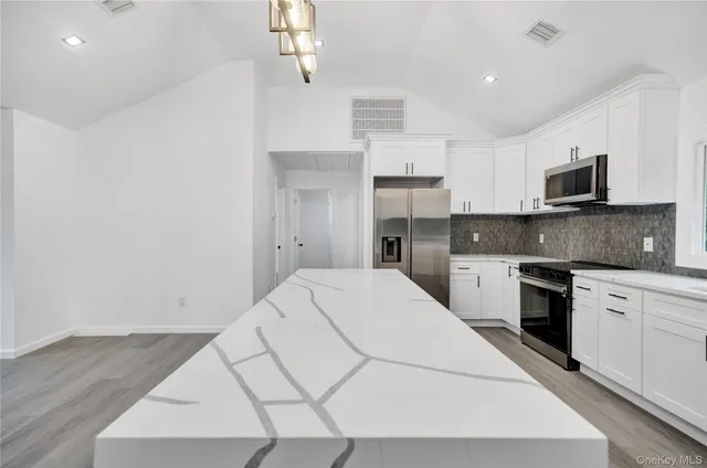 a view of storage and utility room with stairs