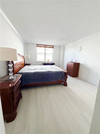 a bedroom with bed and window