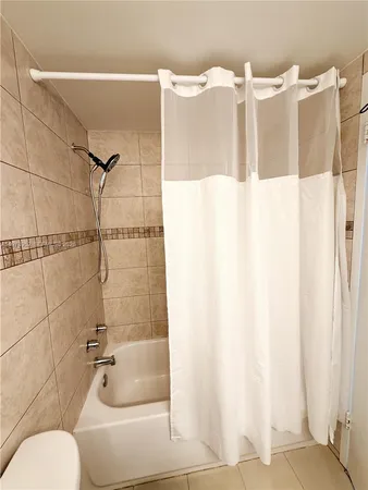 a bathroom with a sink and shower