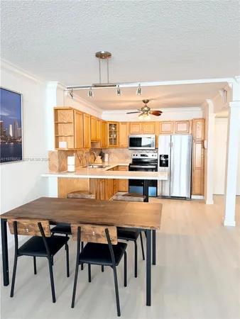 a view of a dining room with furniture and a window