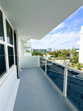 a living room with stainless steel appliances granite countertop lots of counter top space and furniture