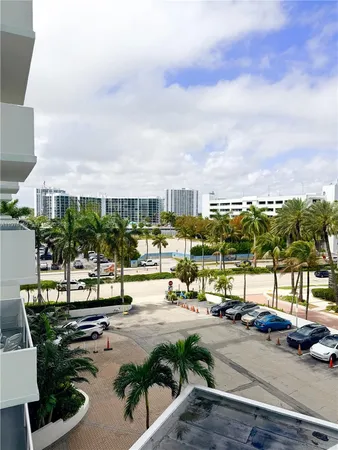 a view of lobby with seating area and car parked