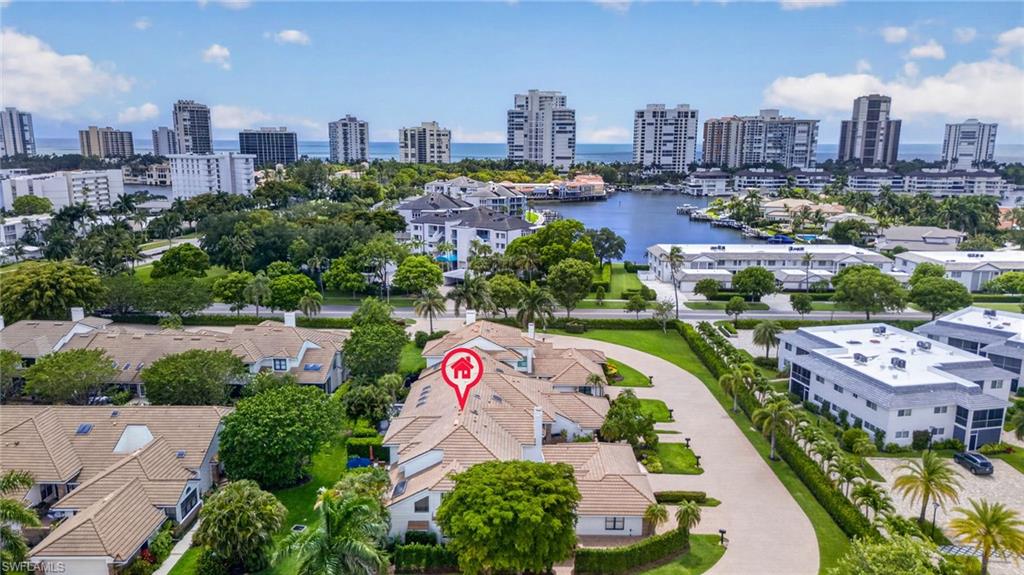 4030 Crayton Road, Unit C2 Naples, FL 34103 - Photo 5 of 32 a city view with a lake