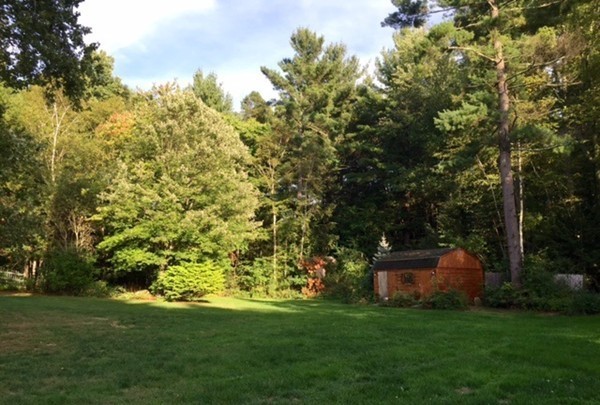 30 Douglas Road Dracut, MA 01826 - Photo 13 of 14 a backyard of a house with lots of green space