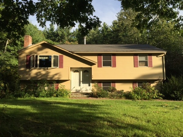 30 Douglas Road Dracut, MA 01826 - Photo 2 of 14 a front view of a house with a yard