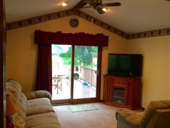 30 Douglas Road Dracut, MA 01826 - Photo 6 of 14 a living room with furniture and a flat screen tv