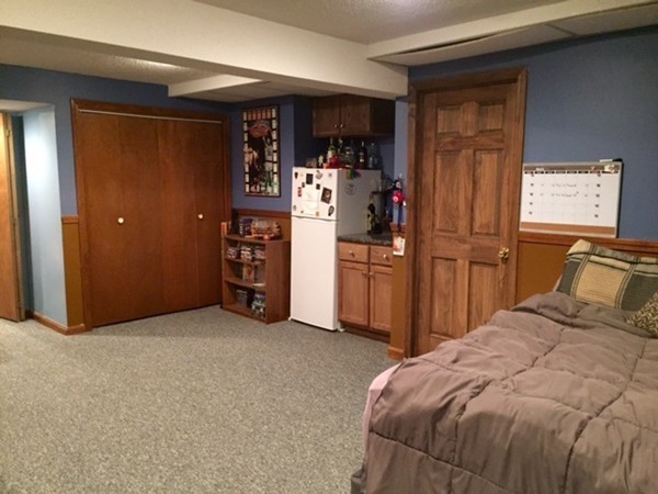 30 Douglas Road Dracut, MA 01826 - Photo 8 of 14 a bed room with a bed and a television