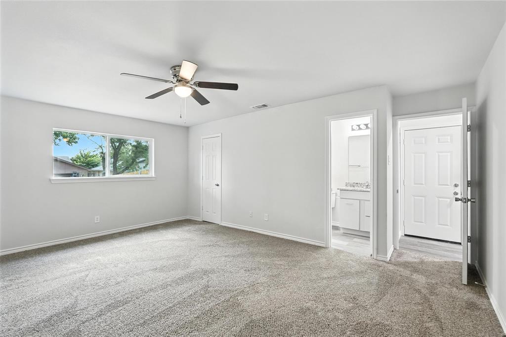 4613 Tarry Drive Garland, TX 75043 - Photo 19 of 38 a view of a room with chandelier fan and windows