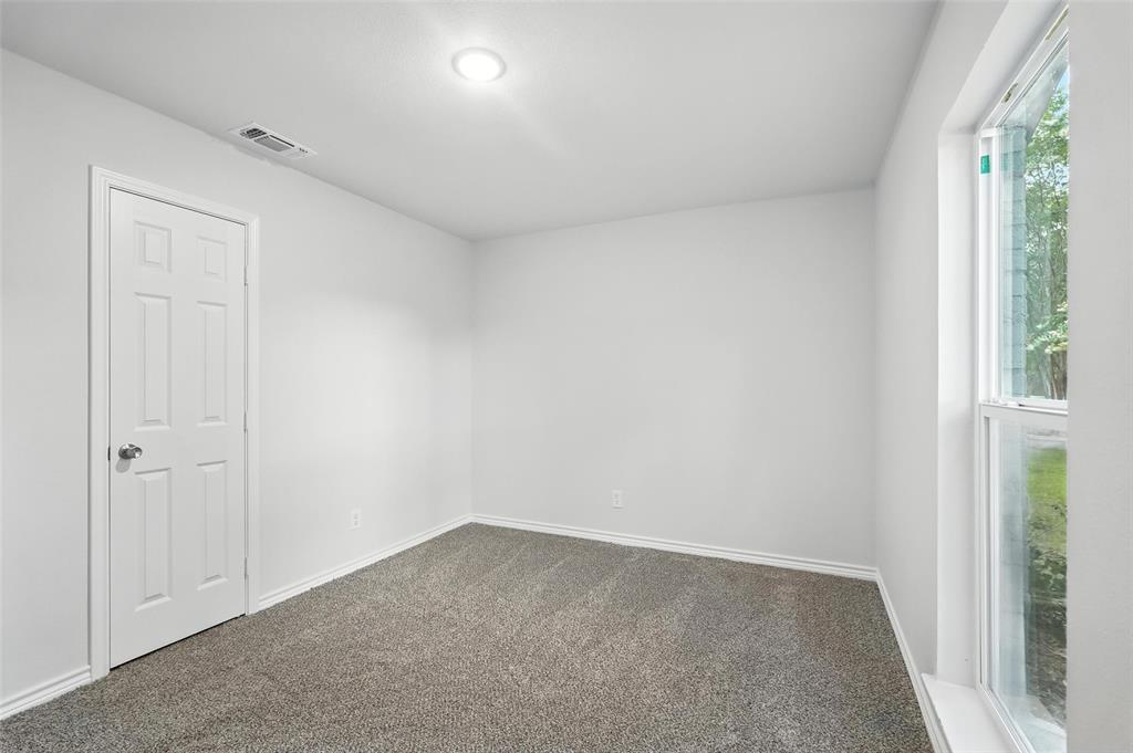 4613 Tarry Drive Garland, TX 75043 - Photo 26 of 38 an empty room with windows