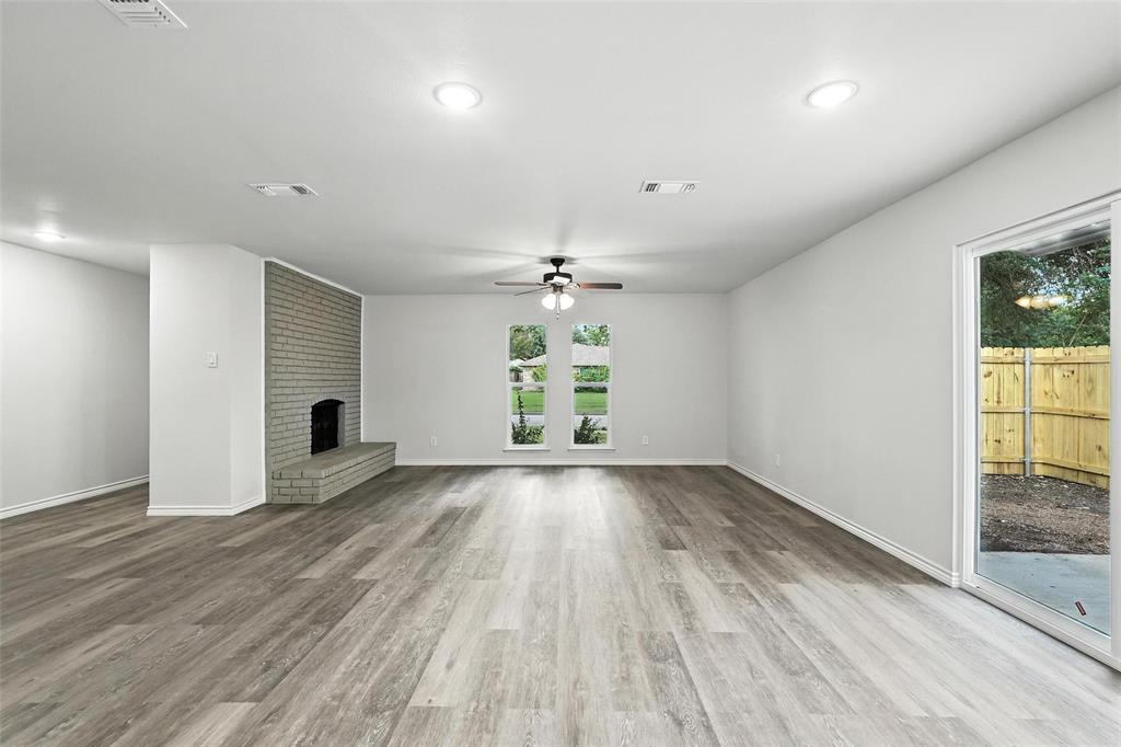 4613 Tarry Drive Garland, TX 75043 - Photo 31 of 38 wooden floor in an empty room with a window
