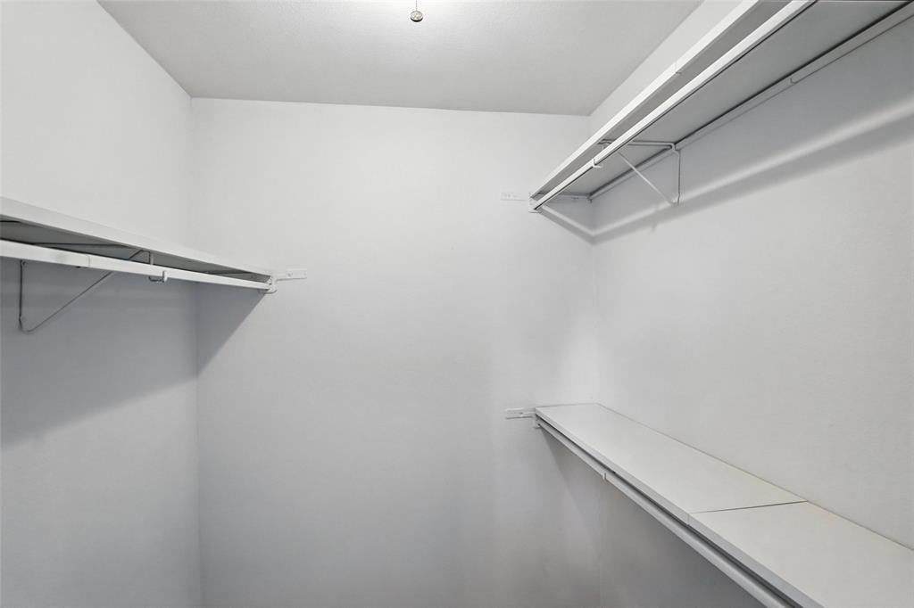 4613 Tarry Drive Garland, TX 75043 - Photo 32 of 38 a view of an empty walk in closet
