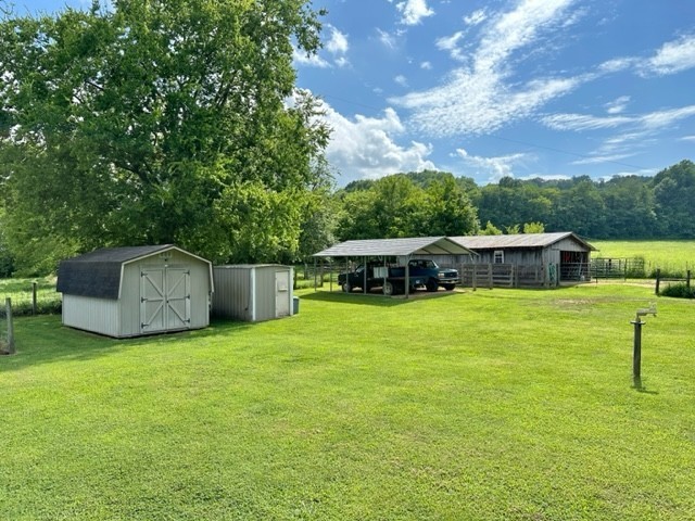 2244 Baptist Branch Road Mount Pleasant, TN 38474 - Photo 15 of 47 a view of a garden with a bench in the background