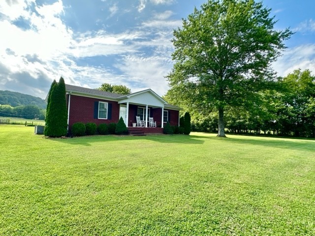 2244 Baptist Branch Road Mount Pleasant, TN 38474 - Photo 16 of 47 a front view of house with yard and entertaining space