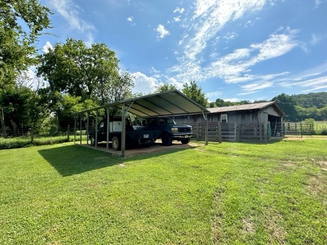 2244 Baptist Branch Road Mount Pleasant, TN 38474 - Photo 26 of 47 a view of a house with a backyard