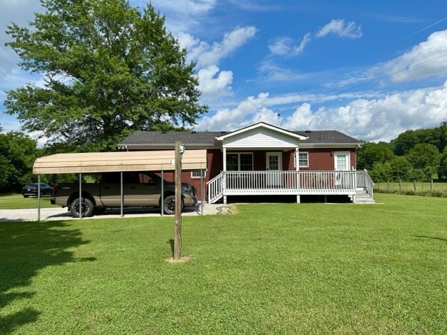 2244 Baptist Branch Road Mount Pleasant, TN 38474 - Photo 27 of 47 a view of a house with a backyard