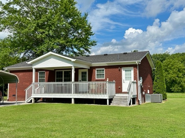 2244 Baptist Branch Road Mount Pleasant, TN 38474 - Photo 29 of 47 a front view of a house with a garden